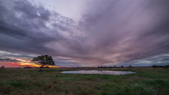 Time Lapse in Namibia - Watering Hole cloudsing past alt