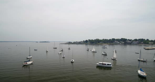 Boats Docked and Ferry Passing on Echo Bay on a Cloudy Day alt