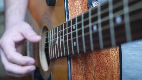 Acoustic Guitar in Man's Hands