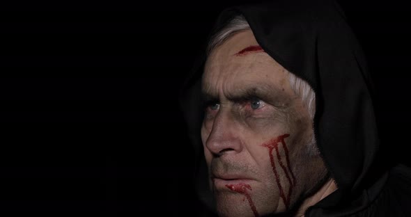 Old Executioner Halloween Makeup and Costume. Elderly Man with Blood on His Face alt