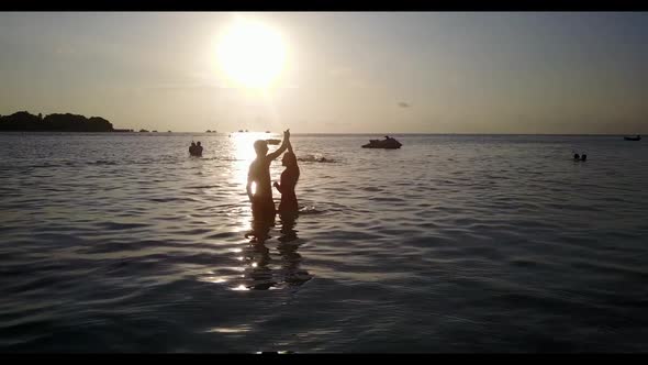 Romantic couple posing on marine coastline beach break by blue lagoon with white sand background of  alt