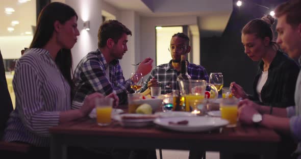 Man Cycling on the Machine Trainer He is Exercising in the Home alt