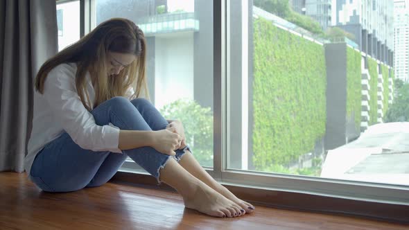Depressed woman sitting alone with cuddle herself and Loneliness sad female think life problem  alt