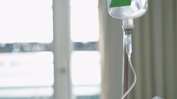 Close up saline drip or saline transfusion for patient and Infusion pump in hospital or clinic alt