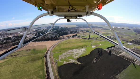 Camera Mounted Underneath Helicopter Flying Over Stillaguamish River Reflections Off Water alt
