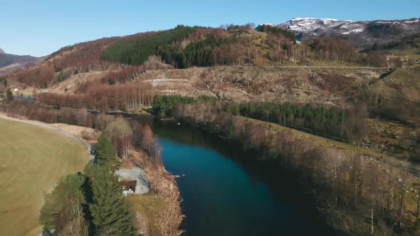 Scenic View Of Årdalselva River In Norway During Daytime - aerial drone shot alt