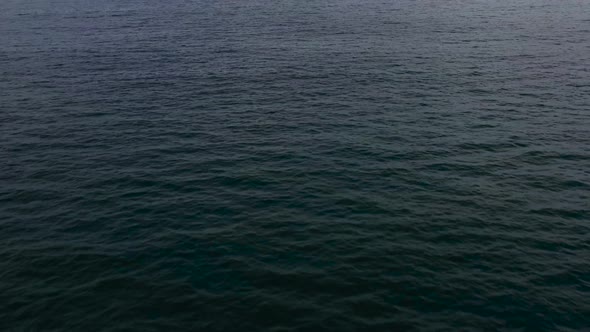 Seascape in the Early Morning. The Sea and the Island in the Distance. alt