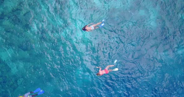 Tropical flying tourism shot of a sandy white paradise beach and blue sea background in high resolution alt