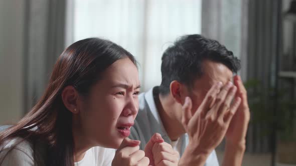 Upset Young Asian Couple Is Frustrated About The Loss Of The Team In Game They Are Watching Tv alt