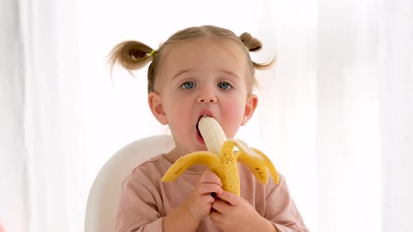Funny Girl Eating Fresh Banana alt