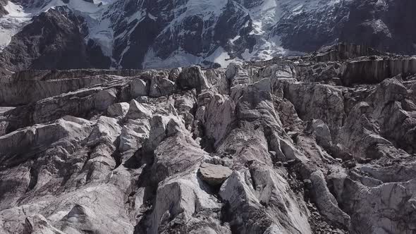 Epic Flight Above Thousands Cracks of Mizhirgi Glacier in Caucasus Mountains