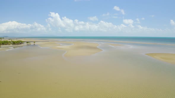 Aerial View On Low Tide, Huge Sand Ocean Bed And Mangroves Growing In Queensland Australia