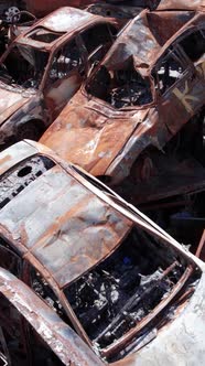 Vertical Video of Burnt Cars During the War in Ukraine alt