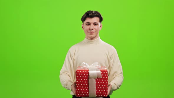 The Man is Standing and Looking at the Camera alt