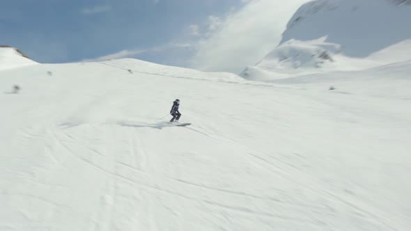Aerial View Sports FPV Drone Flying Following to Female Skier Rides Carving Resort Krasnaya Polyana alt