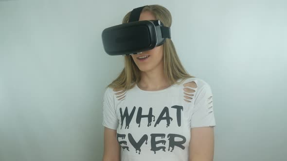 Sexy Girl Uses A Modern Helmet Of Virtual Reality