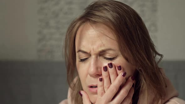 Woman Suffers From Severe Toothache