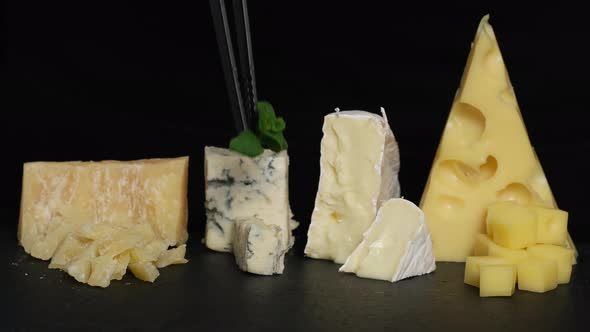 Preparation of cheese plate. Dish serving, food serving process
