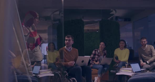 Businesswoman in Wheelchair Having Business Meeting with Team at Modern Office alt