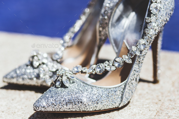 Expensive shoes with jewelry shine in the sun