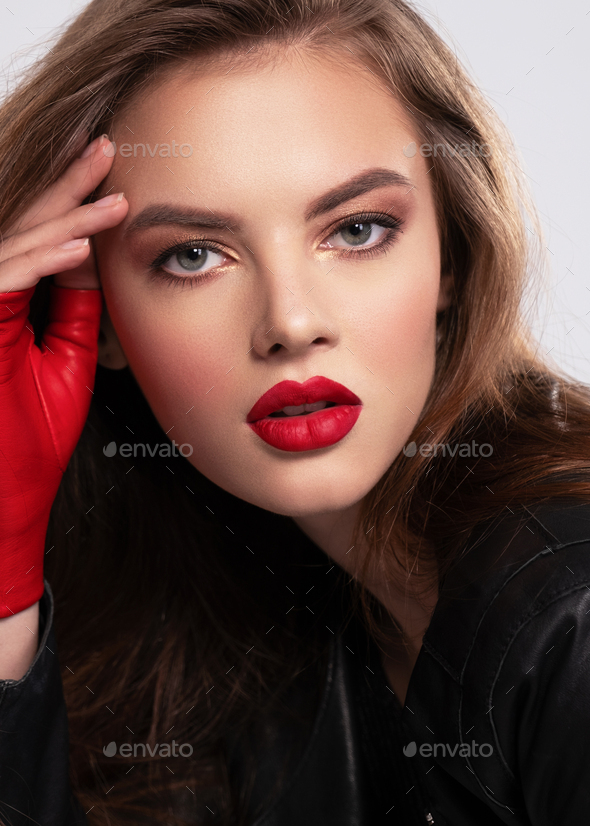 Portrait of beautiful young woman with bright makeup. Beautiful
