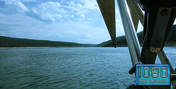 View From Boat's Bow On Mountain Lake Sailboat
