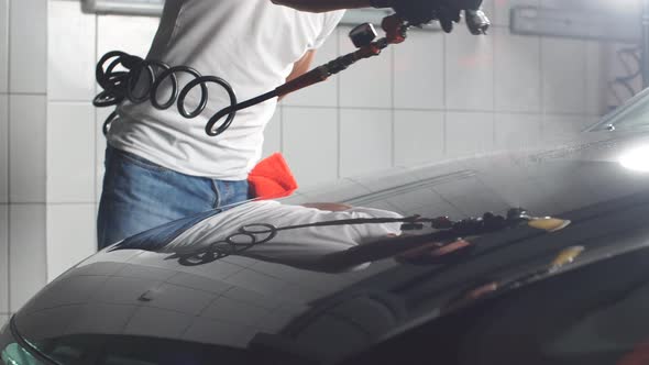Spray Gun with Ceramic Coating for Coating a Car.