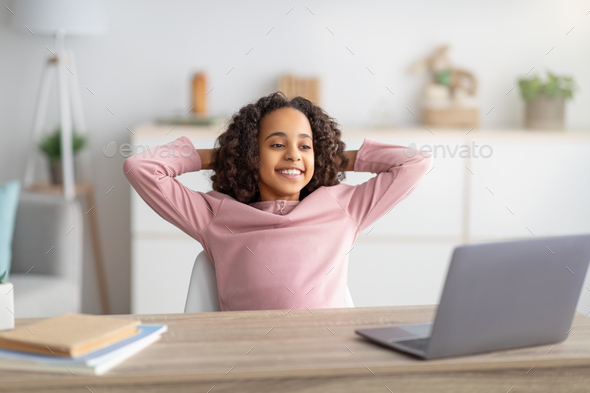 Curious Preschool African Mixed Race Girl Using Laptop at Home