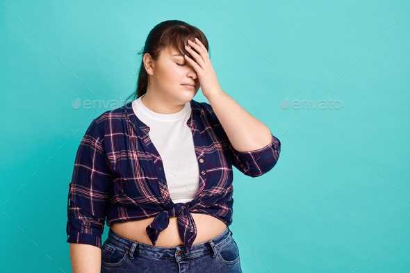 Frustrated overweight woman, body positive