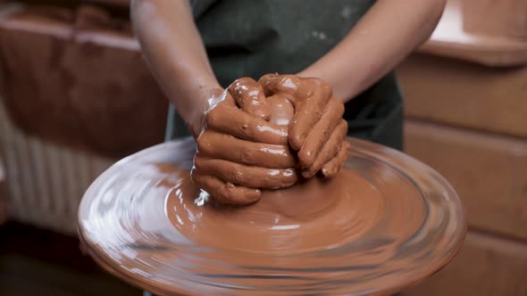 Wheel Potter Hand Clay Shaping or Sculpting