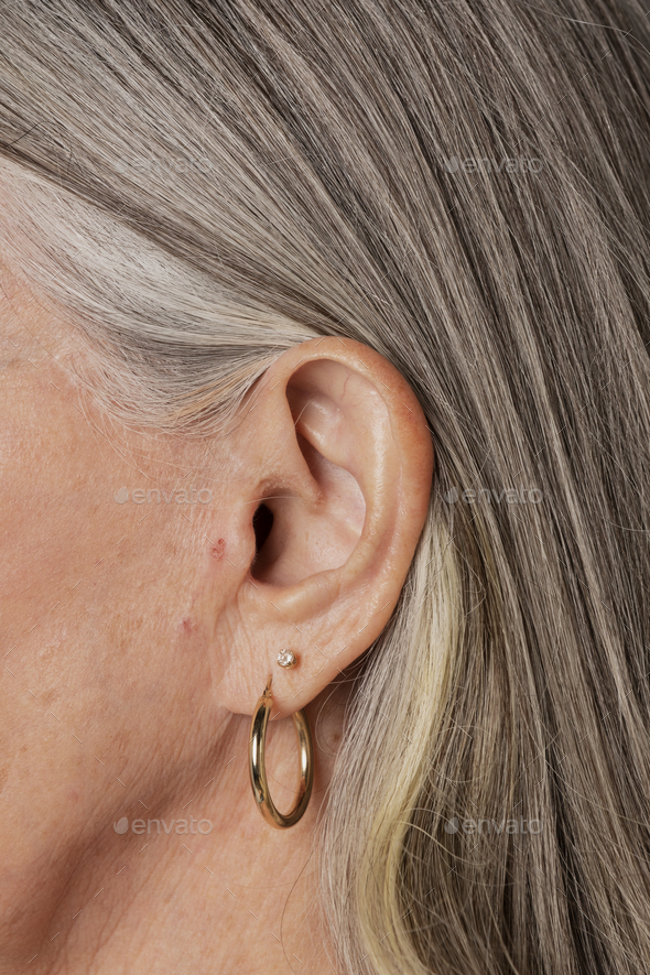 Senior woman wearing hoop earrings