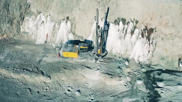 Top View of a Drilling Machine Working in the Copper Mine Site alt