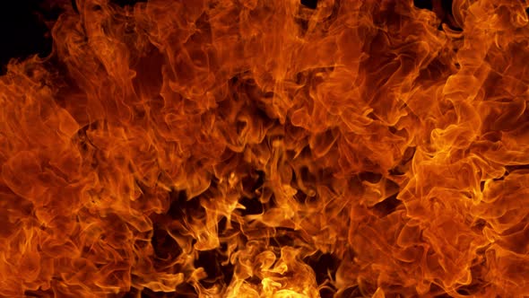 Super Slow Motion Detail Shot of Fire Explosion Against the Black Wall at 1000Fps. alt