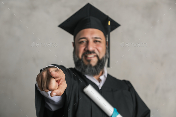 Happy senior man completing his master's degree