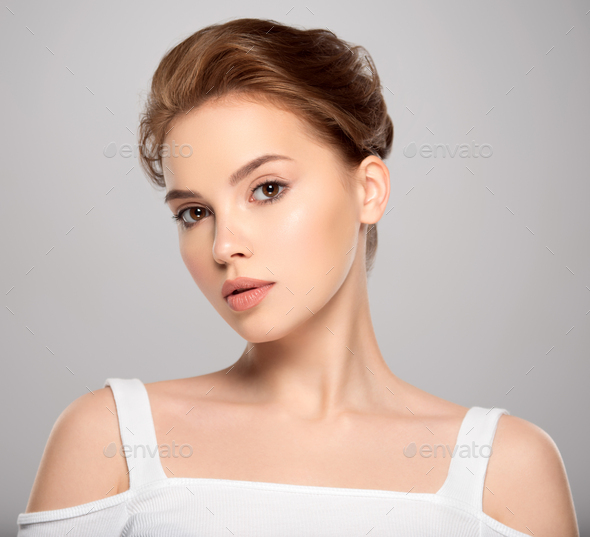 Beauty face of the young beautiful woman Stock Photo by valuavitaly