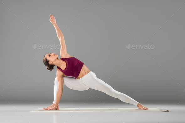 Young woman doing yoga exercise Utthita Parsvakonasana (Extended Side Angle  Pose). Isolated on white background Stock Photo - Alamy