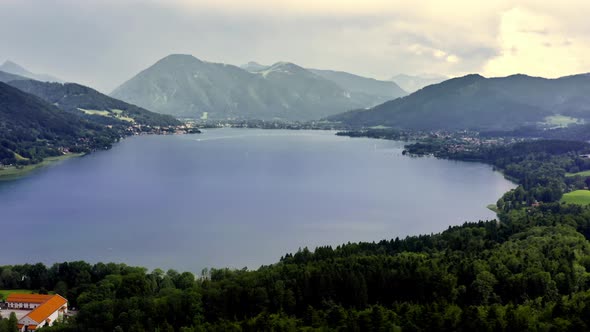 Wide view over the bavarian Tegernsee panning right to reveal the beautiful landscape of the big lak alt