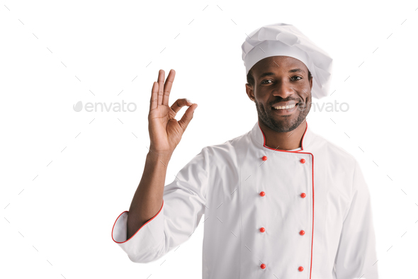 smiling african-american chef showing okay sign isolated on white Stock ...