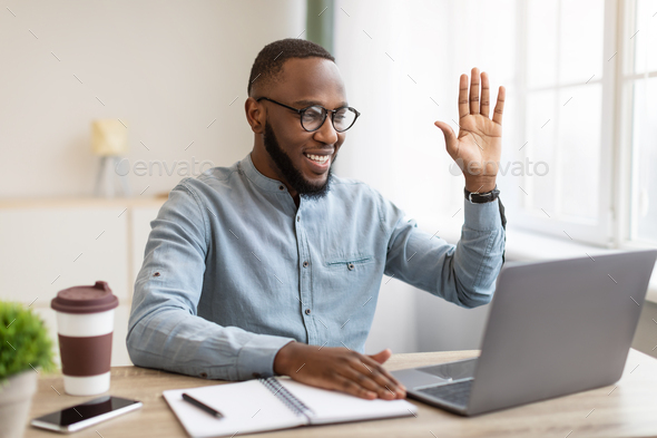 Black Business Guy Making Video Call On Laptop In Office