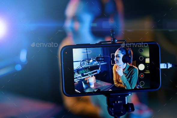 Young woman streaming a live video - Stock Photo - Images
