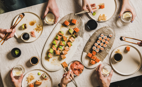 Family or friends having Japanese traditional sushi dinner at quarantine - Stock Photo - Images