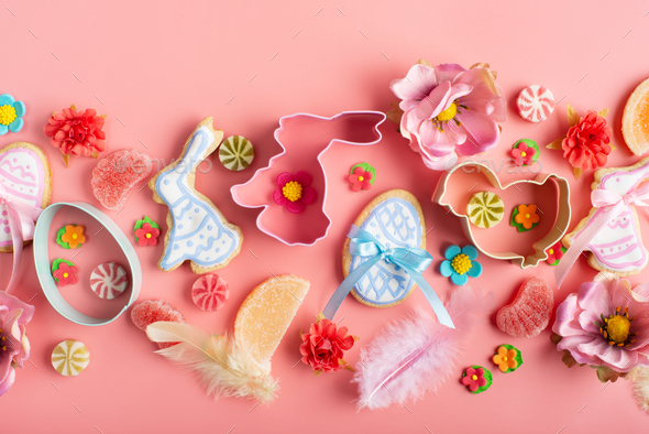 Easter frosted cookies in shape of egg chicken and rabbit, sugar sprinkles, candies, cookie cutters - Stock Photo - Images