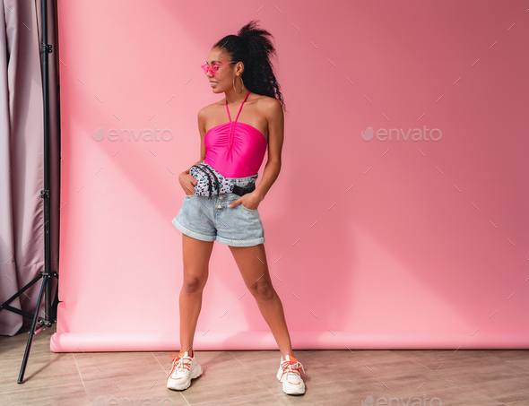 Photo of African american woman in pink clothes fashion photo