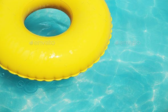 Yellow Swimming Ring on Aqua Blue Water, Summer Background with Copy