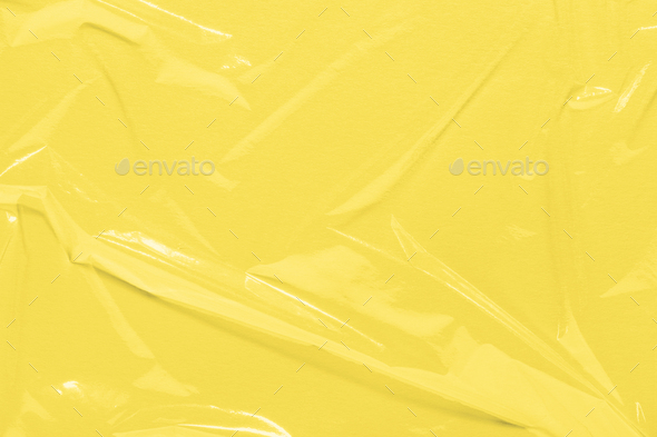 Yellow Wrinkled Cling Film, Plastic Texture, Vinyl Abstract Background.