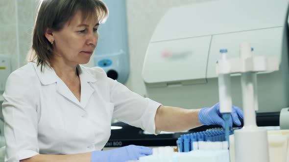 Female Medical Specialist Is Working with Biological Probes alt