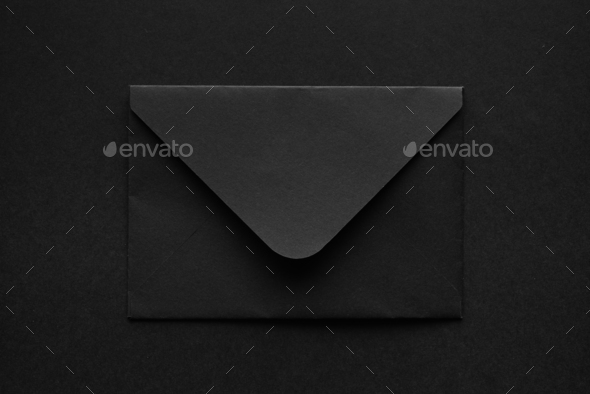 Black envelope on a black background.