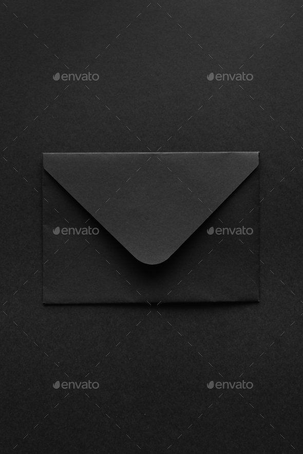 Black envelope on a black background.