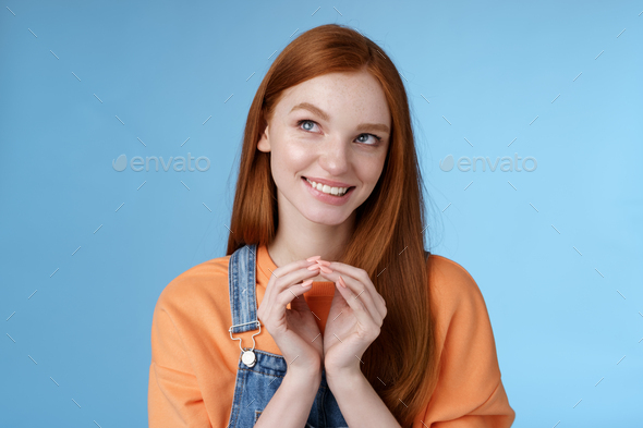 Devious tricky smart pretty redhead girlfriend have evil plan smirking mysteriously look upper left