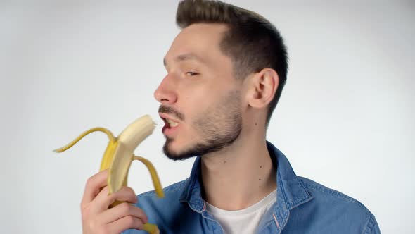 man eating banana